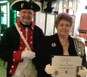 Fort Henry chapter president Jay Frey presented Wheeling Chapter DAR regent Joan McClelland with the Martha Washington medal and certificate for her outstanding support of the SAR.