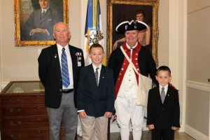 (l to r) Chapter genealogist Gary Auber, his grandson Braedon Wright, chapter president Jay Frey and Logan Wright.